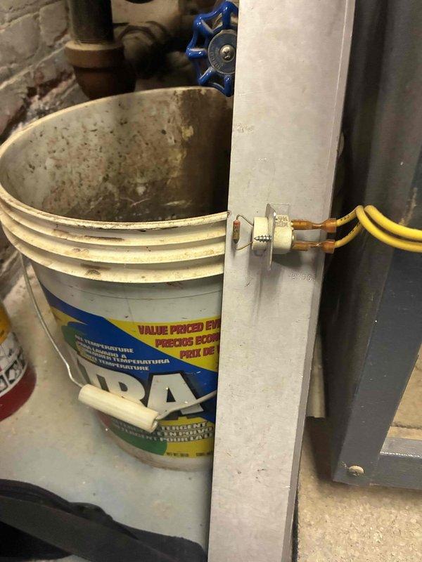 Performed scheduled boiler maintenance, including system inspection and testing. Utilized digital diagnostic equipment to measure operational parameters (152/32.2 reading observed) and checked drainage system components. All systems functioning within normal parameters after service completion.