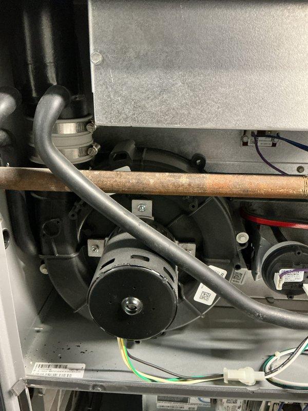 Performed comprehensive heating maintenance on Honeywell furnace system. Inspected internal components including blower motor, control boards, and wiring harnesses; all found to be properly installed and in normal working condition. Checked ventilation system including PVC pipes and connections which were verified secure with no visible damage or abnormal conditions.
