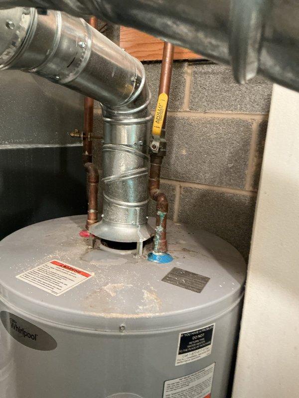 Responded to no hot water call for Whirlpool tanked water heater. Inspected unit and found pilot light was out; successfully relit pilot and confirmed proper flame pattern through viewing window. Tested hot water function and verified system is now operating normally.