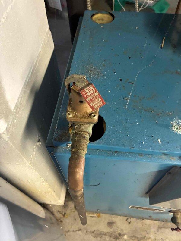 Performed scheduled maintenance on water boiler system. Inspected heat exchanger components for signs of wear and corrosion. Checked pressure regulator valve and associated copper supply line connections; noted minor corrosion on piping requiring monitoring on next service visit.