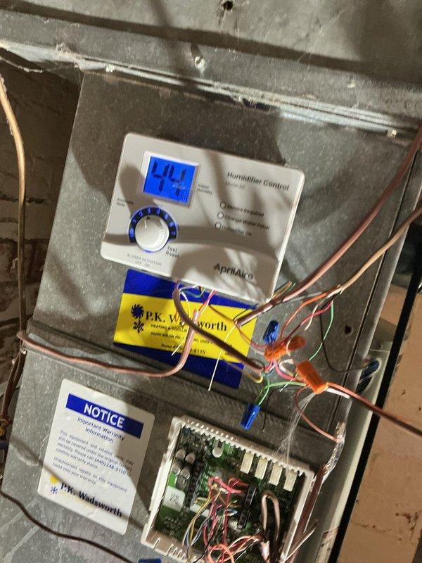 Performed warranty follow-up inspection on recently installed gas furnace system experiencing ignition failure. Verified proper burner operation and flame sequence as evidenced by normal heating element function. Inspected and confirmed appropriate wiring connections throughout the system and validated humidifier control functionality, which was operating at 40% humidity setting. All components now functioning within manufacturer specifications with heat restored.