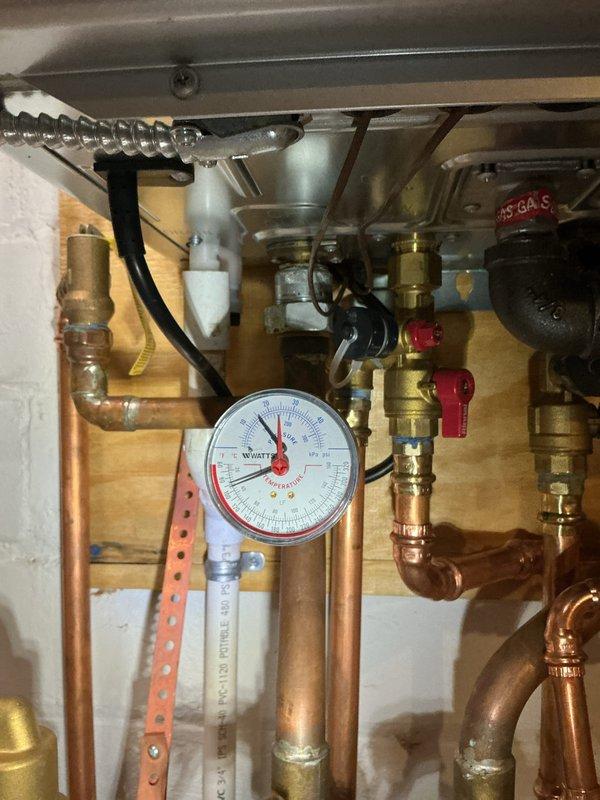 Performed scheduled maintenance service on water boiler system, inspecting all copper supply/return lines and brass valves for proper operation. Checked system pressure readings on Watts gauge, verified all soldered joints were intact, and confirmed proper operation of the furnace unit with no issues detected.