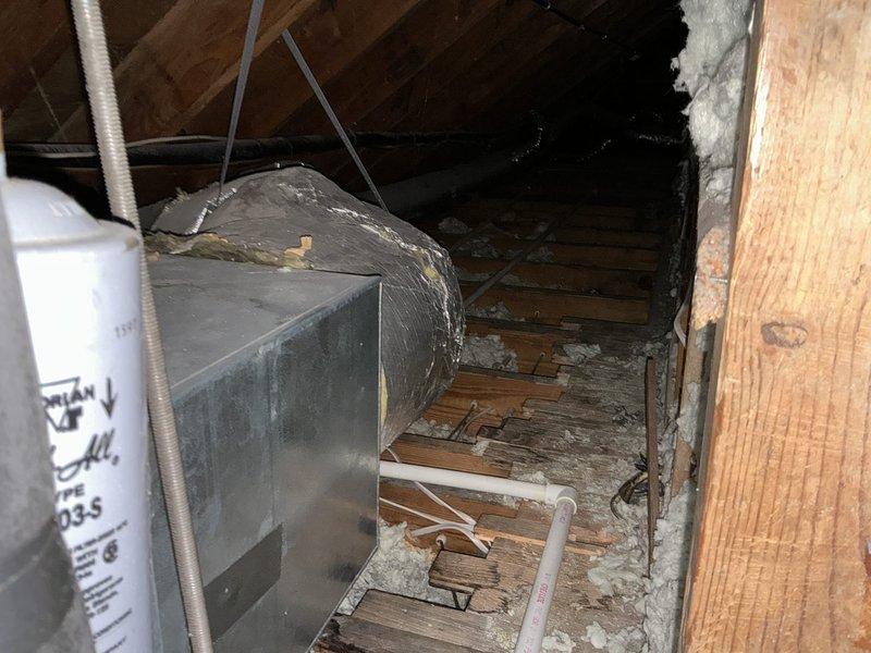 Completed inspection of existing HVAC system in attic space, documenting deteriorated duct insulation and evaluating current installation. Identified aging flexible ducts with compromised insulation and assessed structural conditions affecting system performance. Presented replacement options for both HVAC system and water heater, with additional option for upgraded larger capacity water heater.