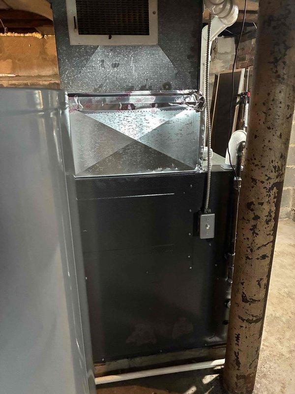 Successfully installed a new Amana high-efficiency 96% AFUE furnace in the basement utility area, including proper connection of PVC venting, condensate drain line, and integration with existing ductwork. All connections were sealed with metal tape and the system was tested for proper operation before completing the job.