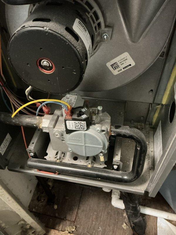 Completed comprehensive maintenance on furnace heating system, inspecting blower motor assembly and gas valve components for proper operation. System was found to be functioning correctly with no issues identified; also documented existing Bradford White water heater installation with proper ventilation and plumbing connections in good condition.