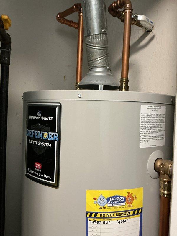 Completed comprehensive maintenance on furnace heating system, inspecting blower motor assembly and gas valve components for proper operation. System was found to be functioning correctly with no issues identified; also documented existing Bradford White water heater installation with proper ventilation and plumbing connections in good condition.