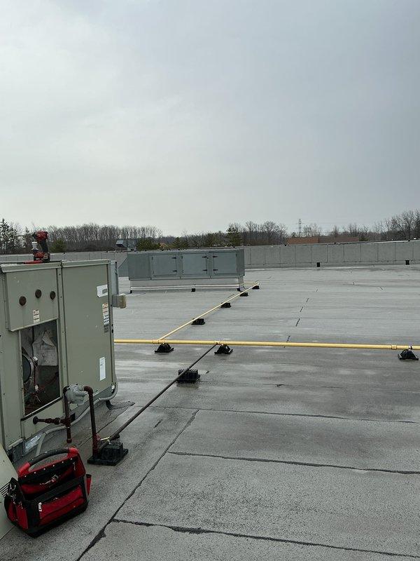 Responded to commercial furnace service call following power outage affecting multiple heating systems. Conducted rooftop inspection of HVAC equipment, examining internal components and connections of multiple commercial units. Restored proper operation to affected heating systems by resetting controllers and verifying proper function after power interruption.