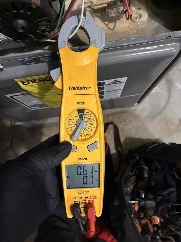 Performed comprehensive heating system maintenance on residential furnace unit. Conducted electrical diagnostics using clamp meter, confirming proper amperage (0.6A) and voltage (0.1V) readings across components. Inspected all connections between furnace and water heater, including PVC venting and copper lines, with all systems operating within normal parameters.