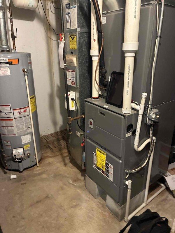 Performed comprehensive heating system maintenance on residential furnace unit. Conducted electrical diagnostics using clamp meter, confirming proper amperage (0.6A) and voltage (0.1V) readings across components. Inspected all connections between furnace and water heater, including PVC venting and copper lines, with all systems operating within normal parameters.