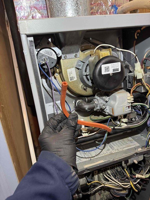 Performed scheduled heating maintenance on furnace system. Inspected internal wiring connections and sensor installation, noting proper placement of control wires (yellow, red). Examined blower assembly and motor components, verifying all electrical connections were secure and functioning correctly.