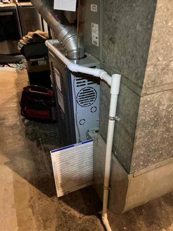 Performed scheduled heating maintenance service on a residential furnace system. Inspected interior components including blower assembly, wiring connections, and drainage system. Replaced air filter and verified proper operation of all system components.