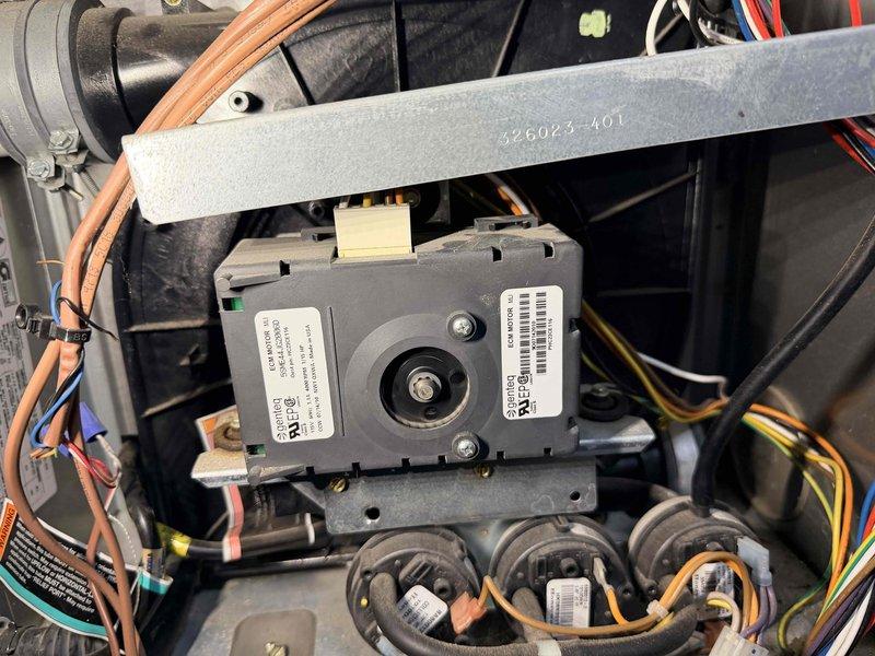 Performed scheduled maintenance service on heating system with dual furnace and boiler components. Inspected control module (part #426023-401) with all electrical connections and wiring harnesses found intact and properly secured. Noted small crack in heat exchanger fins requiring future monitoring, but system currently operating within normal parameters.