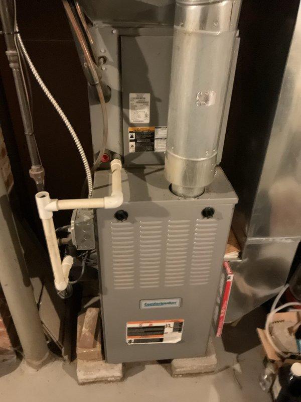 # Service Report

Completed comprehensive heating maintenance on residential forced-air furnace system located in basement mechanical room. Performed standard seasonal maintenance protocol including visual inspection of furnace cabinet, ductwork connections, and associated components; verified proper operation of all safety controls and limit switches; checked combustion chamber and heat exchanger for signs of wear or deterioration; inspected and cleaned burner assembly; tested ignition system functionality; examined flue pipe connections and venting system for proper draft and secure attachment; verified condensate drain lines and PVC drainage system for proper flow and clearance; inspected flexible gas connector for leaks and proper installation; tested blower motor operation and airflow; replaced air filter; checked all electrical connections and wiring for signs of damage or loose terminals; verified thermostat communication and system cycling; and confirmed adequate clearances aro