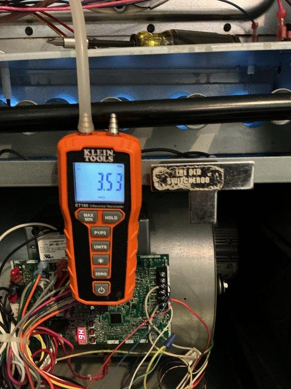 # HVAC Maintenance - Heating System Service Report

Completed comprehensive heating maintenance on residential forced-air furnace system. Performed diagnostic testing of control board and safety circuits using digital multimeter, verifying proper voltage readings and component functionality. Inspected internal electrical connections, control board terminals, and wiring harnesses for signs of wear or deterioration. All connections found secure with no evidence of overheating or corrosion.

Evaluated integrated humidification system, confirming proper installation and operational status of wall-mounted Aprilaire humidifier unit connected to main ductwork. Examined ductwork connections and joints throughout the system for air leakage or separation. Inspected water heater installation in utility closet, noting proximity to HVAC equipment and verifying adequate clearances for safe operation and maintenance access.

Conducted visual inspection of furnace cabinet, heat exchanger accessibility