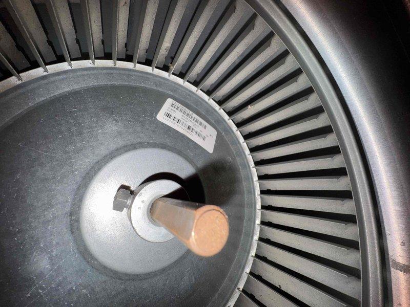 # HVAC Heating Maintenance Service Summary

Completed scheduled preventive maintenance service on residential furnace system as part of ongoing heating maintenance program. Performed comprehensive inspection of blower assembly, verifying proper operation of centrifugal fan wheel and motor shaft alignment. Inspected mechanical mounting components, refrigerant lines, and associated hardware for secure installation and operational integrity. Noted evidence of environmental aging and water staining on surrounding surfaces near equipment installation area, though no immediate impact to system function was observed. All critical components examined and found operational within normal parameters at time of service.