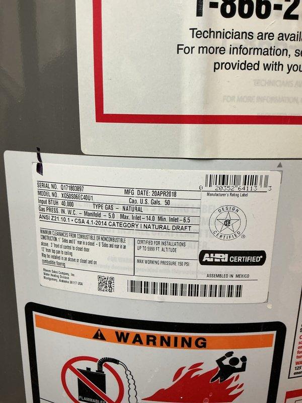 Conducted on-site evaluation of existing 50-gallon natural gas water heater (Rheem model VG5048CP1400U, manufactured April 2018, 40,000 BTU input) for replacement estimate. Unit showed signs of age with visible water staining on concrete floor and wall surfaces around base, indicating potential previous leakage or condensation issues. Documented current installation configuration including copper supply line connections, venting system, and gas line setup. Assessed clearances, accessibility, and existing plumbing infrastructure to determine replacement requirements and provide comprehensive estimate for new water heater installation.