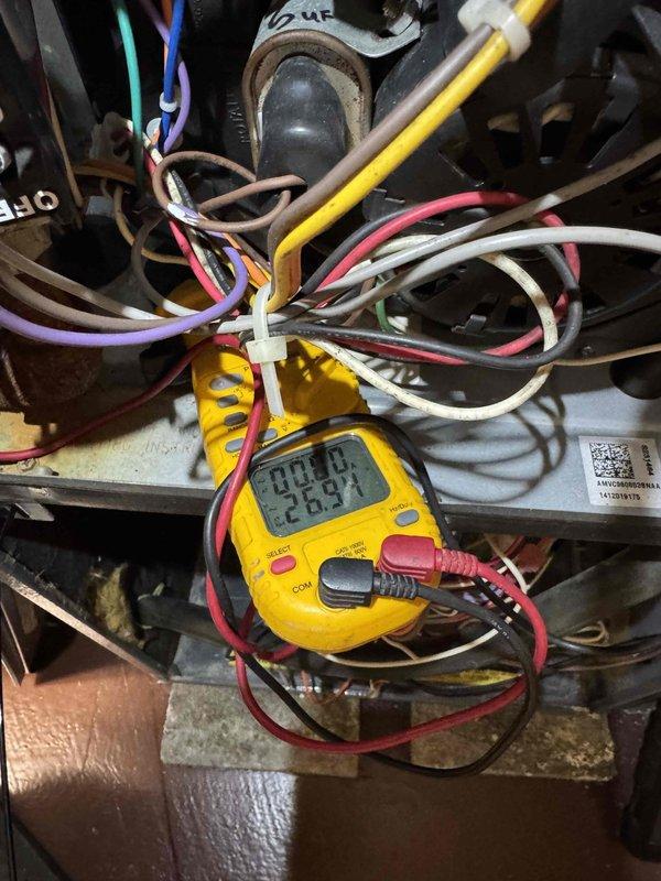 # Service Summary

Responded to no heat call on aging HVAC system. Performed diagnostic testing with multimeter, measuring voltage and capacitance readings to identify system failure. Inspected electrical connections, capacitor assembly, and control wiring throughout the unit. Addressed the heating issue and restored system operation to normal functionality.