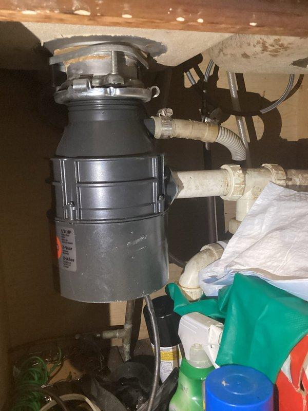 Responded to service call for non-functioning electrical outlet serving garbage disposal unit. Upon inspection, determined that the dedicated disposal outlet had failed, requiring the customer to temporarily operate the unit via extension cord. Replaced defective electrical outlet with new receptacle, restored proper power supply to garbage disposal, and verified full functionality of the unit and electrical connection upon completion.