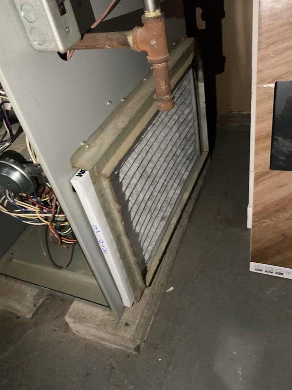 # HVAC Heating Maintenance Service Report

Performed comprehensive heating system maintenance on a Concord brand residential furnace installation. Conducted thorough inspection of the furnace unit, evaporator coil, ductwork connections, and associated HVAC components to ensure proper operation ahead of the heating season.

Inspected the evaporator coil assembly, noting accumulated dust and particulate on the finned surfaces typical of normal system operation. Examined copper refrigerant lines and brass fittings for signs of wear, corrosion, or leaks. Verified all electrical connections, including bundled wiring to the blower motor assembly, were secure and showed no signs of overheating or damage.

Assessed the condition of the metallic ductwork system, including the main trunk lines and flexible duct connections, confirming proper sealing and support. Inspected PVC condensate drain lines for proper pitch and drainage functionality. Verified furnace venting system integrity and clearan