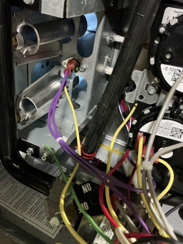 # Service Summary

Responded to no heat call on residential furnace system less than 10 years old. Upon arrival, confirmed unit was not operating and customer had no heat. Performed diagnostic inspection of furnace, removed access panel to examine internal components including blower motor assemblies, electrical connections, and control wiring. Inspected dual motor configuration with fan assemblies, verified all wire connections and terminal blocks for proper seating and continuity. Examined equipment labels and specifications to confirm unit model and operational requirements. Documented system configuration showing furnace installation with ductwork connections and air handler components. Completed visual inspection of all accessible mechanical and electrical components to identify cause of no heat condition.