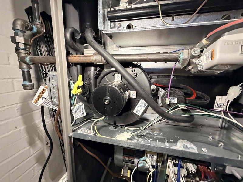 Completed scheduled heating maintenance on residential furnace system as part of ongoing preventative maintenance program. Performed comprehensive inspection of blower assembly, motor components, heat exchanger, gas piping connections, and electrical wiring throughout the system. Blower wheel and housing showed normal dust accumulation consistent with operational use; all mechanical components found functioning within proper parameters with no immediate service needs identified.