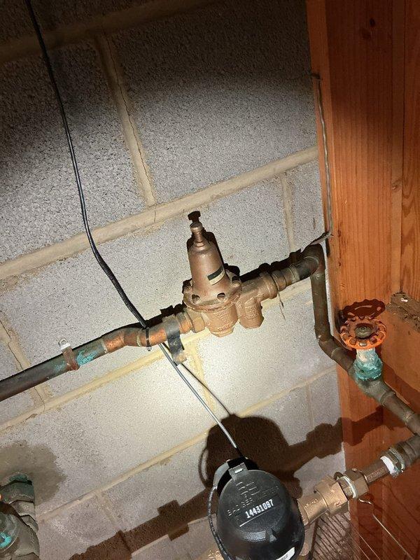 Performed routine maintenance on tanked water heater including complete system flush to remove sediment buildup and ensure optimal performance. Verified burner assembly operation with blue flame visible through inspection port, confirmed proper combustion, and inspected all plumbing connections including pressure reducing valve and shut-off valves for leaks or deterioration.