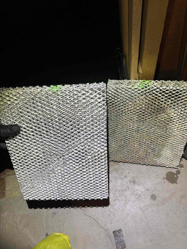 Completed scheduled heating maintenance on residential HVAC system. Replaced heavily soiled humidifier filter pad showing significant mineral buildup and discoloration with new filter to restore proper humidity control and system efficiency. Inspected furnace internal components, blower motor assembly, electrical connections, and control modules, confirming all systems operating properly.