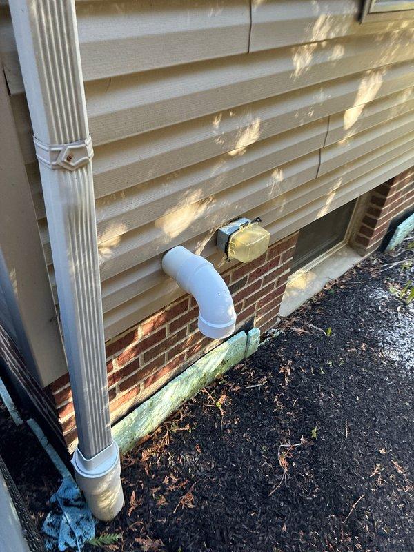 Performed comprehensive assessment of 22-year-old residential furnace system requiring replacement evaluation. Documented existing HVAC infrastructure including exterior condensate drainage configuration and interior thermostat wiring connections with multiple wire terminals (Y, G, R, W, C) to facilitate equipment replacement planning and ensure proper system integration.