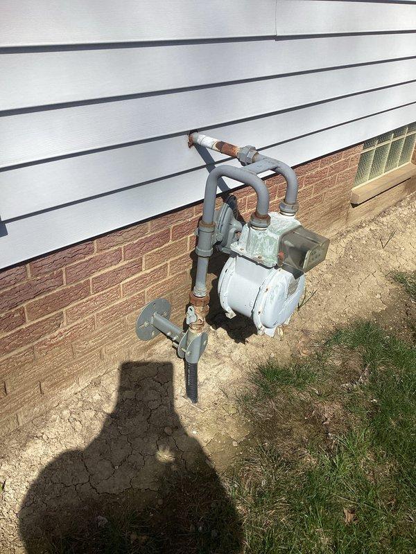 Performed on-site electrical assessment for standby generator installation. Evaluated existing gas meter location and service entrance configuration to determine optimal generator placement and fuel source connection point. Completed comprehensive load calculation per 2023 NEC Article 220 requirements, analyzing general lighting loads, small appliance circuits, laundry loads, electric cooking equipment, HVAC systems, and motor loads to establish total calculated demand load of 13,878 VA. Determined appropriate generator sizing based on electrical load analysis and documented existing utility infrastructure conditions with photographic records for proposal preparation.