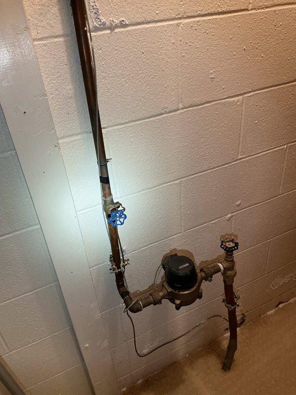 Completed plumbing inspection addressing slow faucet leak in upstairs bathroom and evaluated shower access panel plumbing configuration. Assessed current system requiring full home water shutdown for shower service and provided recommendations for installing isolation valves to allow localized shutoff capability. Documented existing plumbing infrastructure including tankless water heater installation, main water meter assembly with shutoff valves, and copper supply line routing for quote preparation.