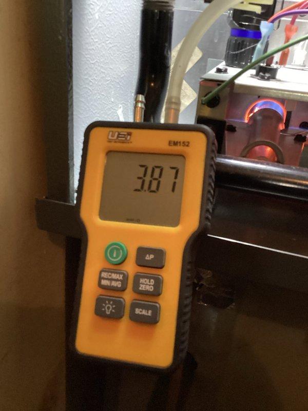 Completed comprehensive heating system maintenance and diagnostics. Performed differential pressure measurements reading 387 using calibration equipment and conducted electrical diagnostics on the control board, measuring voltage readings of 0.031V and 0.746V to verify proper system operation. All components inspected, tested, and confirmed functioning within manufacturer specifications.