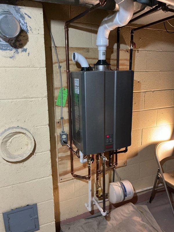 Performed routine maintenance and flushing service on wall-mounted tankless water heater unit. Descaled the heat exchanger, cleaned inlet filter screen, inspected all copper supply lines and brass shut-off valves for proper operation, and verified venting system integrity. All components tested and operating within manufacturer specifications upon completion.