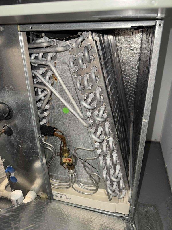 Completed scheduled heating maintenance on HVAC system per contract fulfillment requirements. Performed comprehensive inspection of evaporator coil, refrigerant lines, and heat exchanger components; verified proper operation of all mechanical and electrical systems; documented unit condition with photographic records showing serpentine coil assembly, copper refrigerant lines with service ports, and interior components in satisfactory working order.