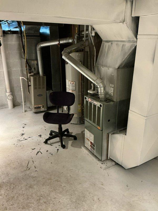 Provided furnace replacement options for a rental property with emphasis on basic, cost-effective system solutions. Assessed existing HVAC equipment in basement mechanical room, documenting aging infrastructure including corroded piping, multiple furnace units, and ductwork configuration to determine appropriate replacement specifications.