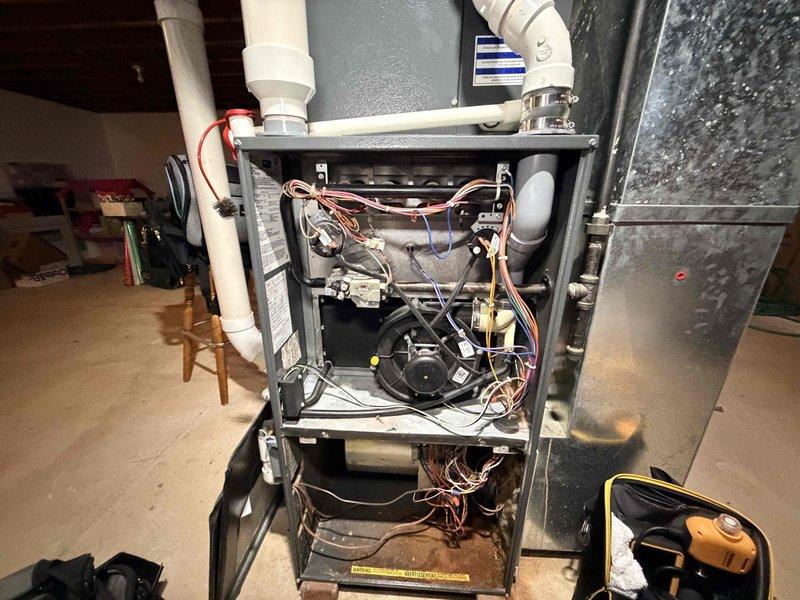 Completed scheduled preventative maintenance on residential gas furnace system as part of ongoing heating service plan. Performed comprehensive inspection of all internal components including blower motor assembly, control boards, electrical connections, refrigerant lines, and condensate drainage system. Verified proper operation of centrifugal blower wheel and motor, confirmed all wiring connections were secure, and inspected PVC venting for proper installation and drainage. All components found to be in good working order with no deficiencies noted. Unit operating within normal parameters upon completion of maintenance visit.