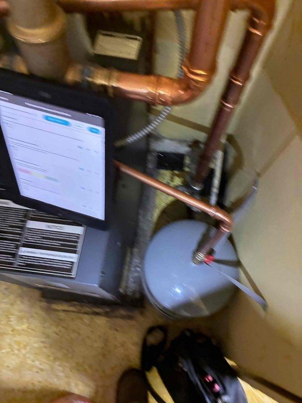 Completed routine heating maintenance on residential HVAC system. Performed comprehensive inspection of furnace/air handler unit, verified proper operation of digital control interface, and examined all accessible mechanical components. Inspected copper refrigerant lines and water circulation piping for leaks or damage, confirmed secure connections at soldered joints, and verified integrity of pipe insulation. Checked expansion tank mounting and connections, examined flexible ductwork attachments, and assessed overall system condition in mechanical room, finding all components operating within normal parameters.