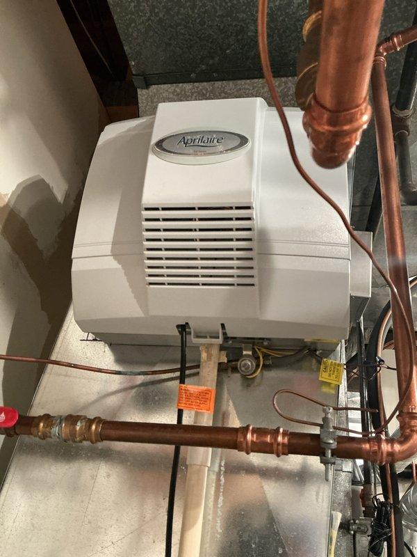 Completed heating maintenance on gas furnace system and whole-house humidification equipment. Performed comprehensive inspection of furnace burner assembly, confirmed proper flame pattern and combustion characteristics with all burners operating efficiently. Verified electrical connections, control wiring, and motor components functioning within normal parameters. Inspected and serviced Aprilaire humidifier unit including water supply lines, drainage connections, and humidistat controls to ensure optimal humidity management throughout the heating season.