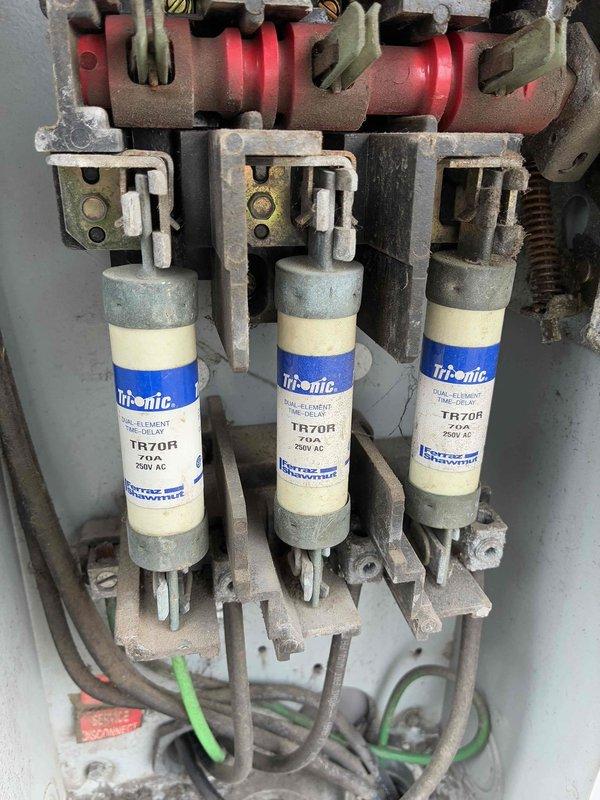 Responded to no heat call for two rooftop units unable to maintain temperature above 61°F despite thermostats set to 90°F. Inspected Bryant RTU model 580JP14D250A3A0ADA and verified electrical components including disconnect box with three Tri-onic TR70R 70A 600V fuses, all found in proper working condition. Also inspected additional rooftop unit as requested to ensure all HVAC systems were operational.