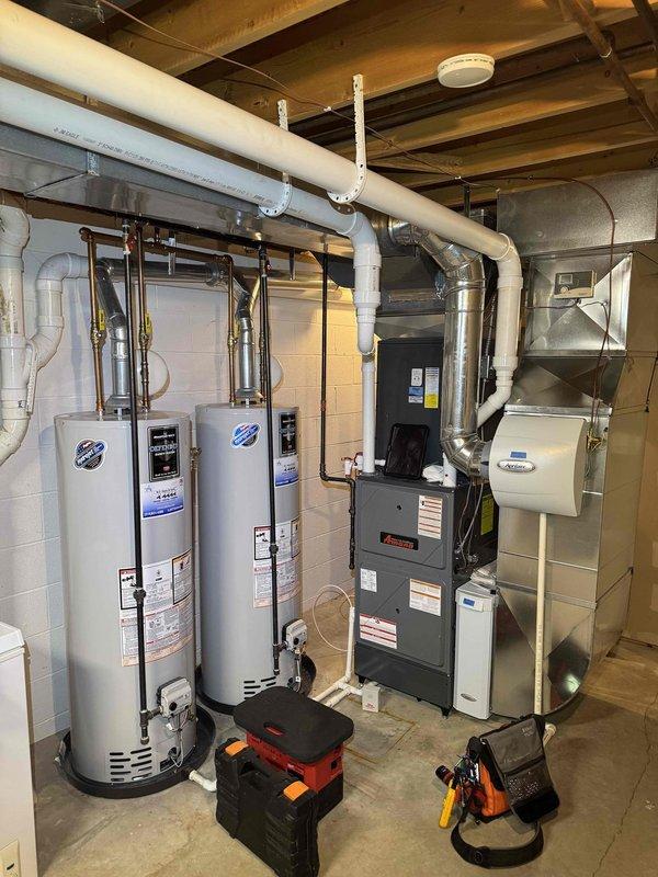 Completed comprehensive 5-year preventive maintenance inspection on residential furnace and HVAC system. Performed diagnostic measurements on air handler unit, verified proper temperature readings at 30.1°F on refrigerant lines, inspected ductwork insulation and copper piping for integrity, and confirmed all mechanical components including dual water heaters and furnace unit were operating within manufacturer specifications with proper ventilation and support structures intact.