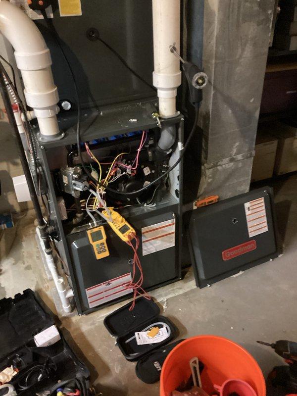 Performed comprehensive first-year heating maintenance on residential furnace system. Conducted complete system diagnostics using Testo 310 combustion analyzer to verify proper burner operation, flue gas composition, and venting efficiency. Accessed internal components through front service panel to inspect control board, wiring connections, and electrical systems. All colored wire connections to circuit board examined and confirmed secure. Evaluated condensate drainage system and PVC venting pipes for proper installation and function. Utilized digital diagnostic meters to test system performance parameters and verify all safety controls operating within manufacturer specifications. Inspected ductwork connections and confirmed proper airflow distribution. System found operating efficiently with all components functioning as designed.
