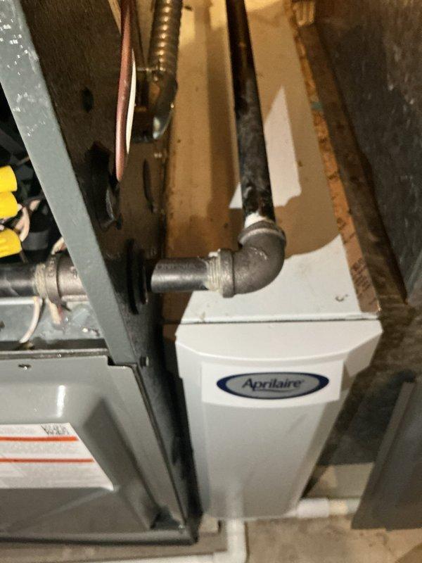 Completed annual heating maintenance on residential HVAC system. Performed comprehensive inspection of furnace components including blower motor assemblies, electrical connections, and safety controls. Verified proper operation of Aprilaire humidifier unit and associated ductwork connections. Inspected all wiring harnesses, confirmed secure connections with wire nuts, and checked motor mounting hardware for proper torque. Examined refrigerant line insulation, flexible conduit routing, and metal ductwork for any signs of wear or deterioration. All components found operating within manufacturer specifications with no immediate repairs required.
