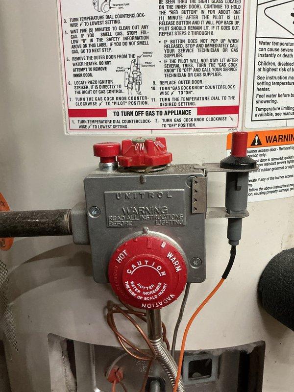 Completed routine water heater maintenance flush on tanked unit equipped with Unitrol gas control valve. Drained sediment from tank through drain valve into utility sink, inspected pressure relief valve and gauge reading within normal operating range, and verified proper operation of gas control assembly and pilot light system. All components including temperature controls, thermocouple connections, and plumbing connections found in satisfactory working condition with no leaks detected upon completion of flush procedure.