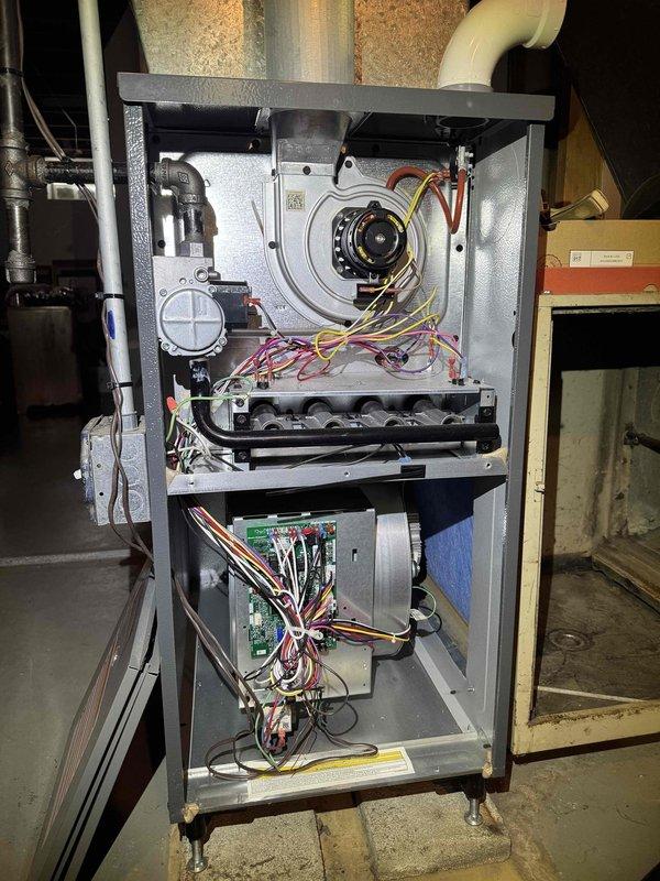 Completed first-year preventative maintenance on residential gas furnace system per annual service plan agreement. Performed comprehensive system inspection with furnace cabinet fully opened to access all internal components. Conducted combustion analysis testing using calibrated digital analyzer, recording temperature and combustion efficiency readings to verify proper burner operation and heat exchanger performance. Visually inspected all major components including blower motor assembly, heat exchanger tubes, pressure switches, control board, and electrical connections. Verified all wire terminations were secure and circuit board showed no signs of damage or overheating. Confirmed blower motor operation and airflow through system. Checked condensate drainage system and PVC venting for proper installation and function. All components found operating within manufacturer specifications with no deficiencies noted. System tested and left in proper working order.