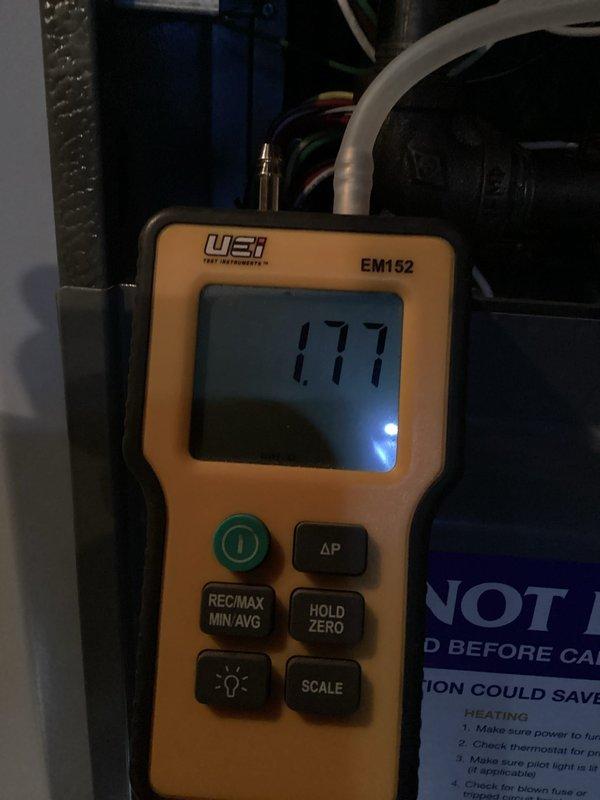 Completed first-year heating system maintenance including full system inspection and performance verification. Measured static pressure readings using calibrated digital manometer, documenting system airflow at 177 pascals, and performed visual inspection of all accessible mechanical components including blower assembly connections and mounting hardware. All equipment found operating within normal parameters with secure fasteners and proper connections throughout the system.