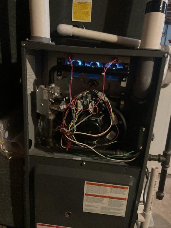 Completed scheduled heating maintenance on residential gas furnace system. Performed comprehensive inspection of all major components including heat exchanger, burner assembly, and flame sensors. Verified proper operation of ignition system with multiple flame sensors functioning correctly. Inspected electrical connections, control board, and wiring throughout unit - all connections secure and operational. Checked venting system including PVC intake and exhaust pipes for proper installation and clearances. Tested furnace operation through full heating cycle, confirming reliable ignition, steady flame pattern, and proper shutdown sequence. All safety controls and limit switches tested and operating within manufacturer specifications. System running efficiently with no issues identified.
