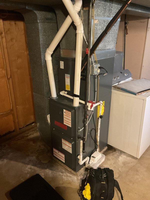 Completed scheduled heating maintenance on residential gas furnace system. Performed comprehensive inspection of all major components including heat exchanger, burner assembly, and flame sensors. Verified proper operation of ignition system with multiple flame sensors functioning correctly. Inspected electrical connections, control board, and wiring throughout unit - all connections secure and operational. Checked venting system including PVC intake and exhaust pipes for proper installation and clearances. Tested furnace operation through full heating cycle, confirming reliable ignition, steady flame pattern, and proper shutdown sequence. All safety controls and limit switches tested and operating within manufacturer specifications. System running efficiently with no issues identified.