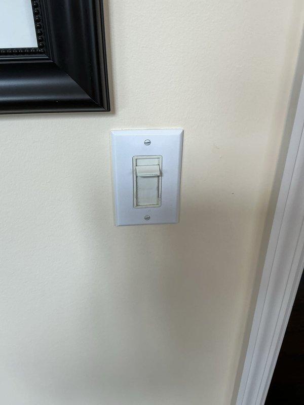 Installed a five-arm brass chandelier with candle-style bulbs and clear glass hurricane shades in dining area at ceiling height of 15-18 feet. Verified proper electrical connections, tested dimmer switch functionality, and confirmed all bulbs illuminated correctly upon completion.