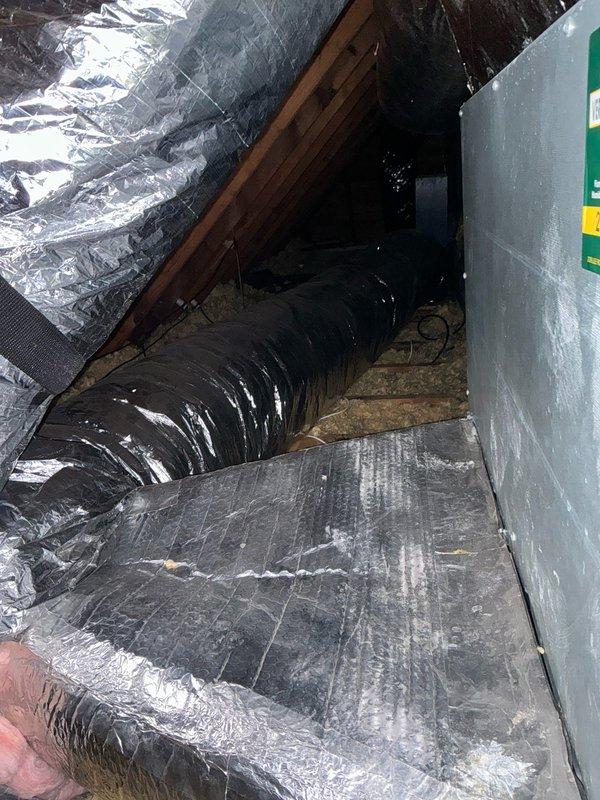 Conducted site assessment for HVAC system replacement options at residential property with existing air conditioning system that has been inoperative for extended period. Property currently utilizes boiler for heating needs. Inspected electrical panel to verify available circuit capacity and breaker configuration for potential new equipment installation. Evaluated attic space and existing ductwork infrastructure, noting flexible duct runs and current insulation conditions. Documented electrical service capacity, attic access, and existing HVAC components to provide comprehensive replacement system recommendations and installation specifications.