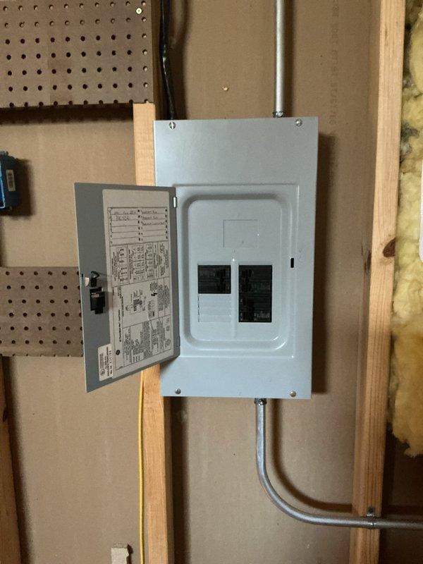 Responded to service call for main breaker repeatedly tripping under minimal electrical load. Upon inspection, found residential electrical panel experiencing nuisance tripping when multiple circuits were energized simultaneously. Performed thorough diagnostic testing of main breaker assembly and branch circuits. Inspected all wire connections at main lugs and verified proper torque specifications. Tested individual circuit breakers for proper operation and amperage ratings. Evaluated overall panel load distribution and identified potential overload conditions. Documented panel configuration showing dual-row breaker arrangement with main disconnect at top position. Verified all conductor terminations were secure and properly sized for their respective breaker ratings. Panel restoration completed with all circuits operational and load properly balanced across phases.
