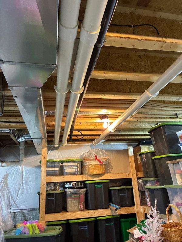 Conducted on-site evaluation for complete HVAC system replacement in residential basement utility area. Assessed existing Bryant furnace unit and adjacent water heater for replacement options, documented current ductwork configuration including main trunk lines and PVC venting system, and provided comprehensive quote for full system replacement with water heater upgrade.